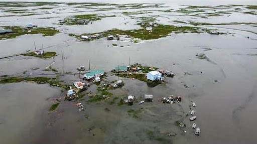 An aerial view of the flooding during an above normal high tide in Kwigillingok, Alaska